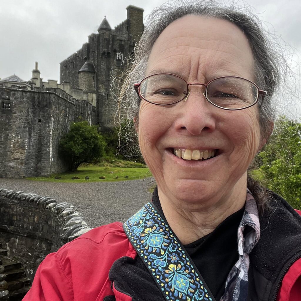 Catherine Devine at Eilean Donan Castle as an independent travel advisor and owner of Byways and Backroads.